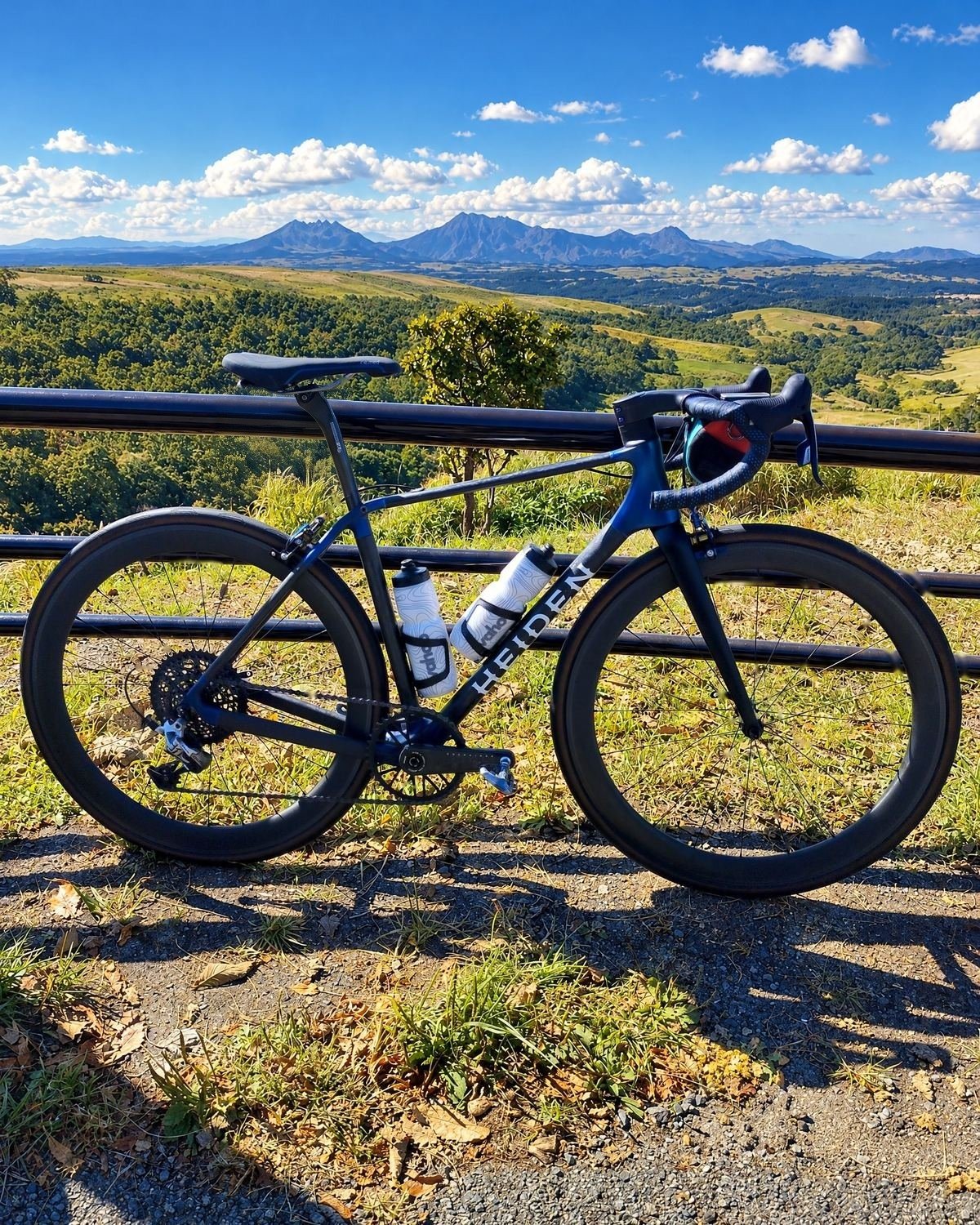 Heiden bike against a railing with volcanic peaks behind